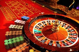 Live dealer studio broadcast showing Infinite Blackjack table with multiple player names visible on screen